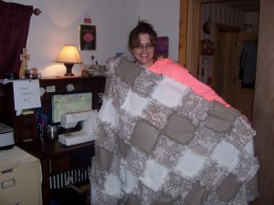 This is the hand-made "rag quilt" that I made for the new happy couple......smile.