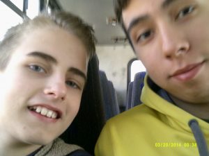 Timothy sitting next to Joel Araiza on the church bus.