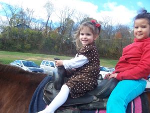 The next church we were at (Sylvania Hills Baptist Church - Pastor Bailey) they had horse rides on their old fashioned Sunday.  We had fun riding the horses! - This is Olivia.