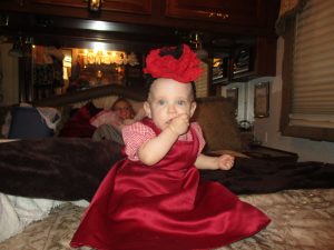 Couldn't resist adding this one........Sofia ready in her "red" outfit (we color coordinate our outfits as we travel).  Isn't the bow on her head cute?!!  It's almost bigger than her head!  My sister Angie made it for her and has tried to make one for every color of our outfits.  SO CUTE!!